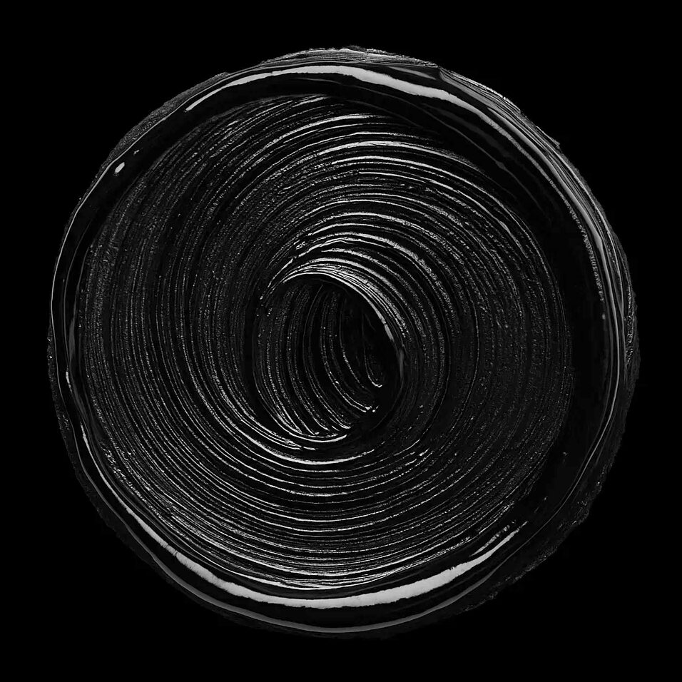 High contrast black and white image of a circular swirl of paint in stark relief